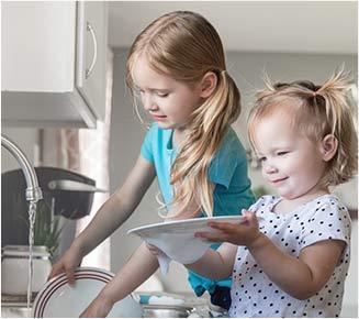 Children washing dishes
